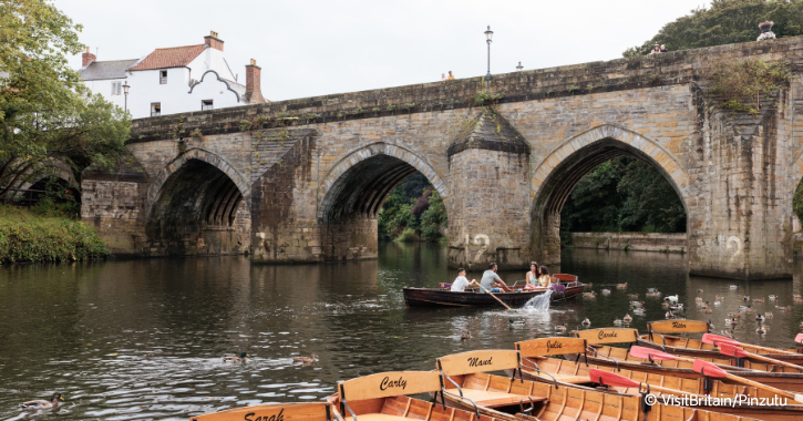 Family in a Brown's Rowing Boat on the River Wear in Durham City.